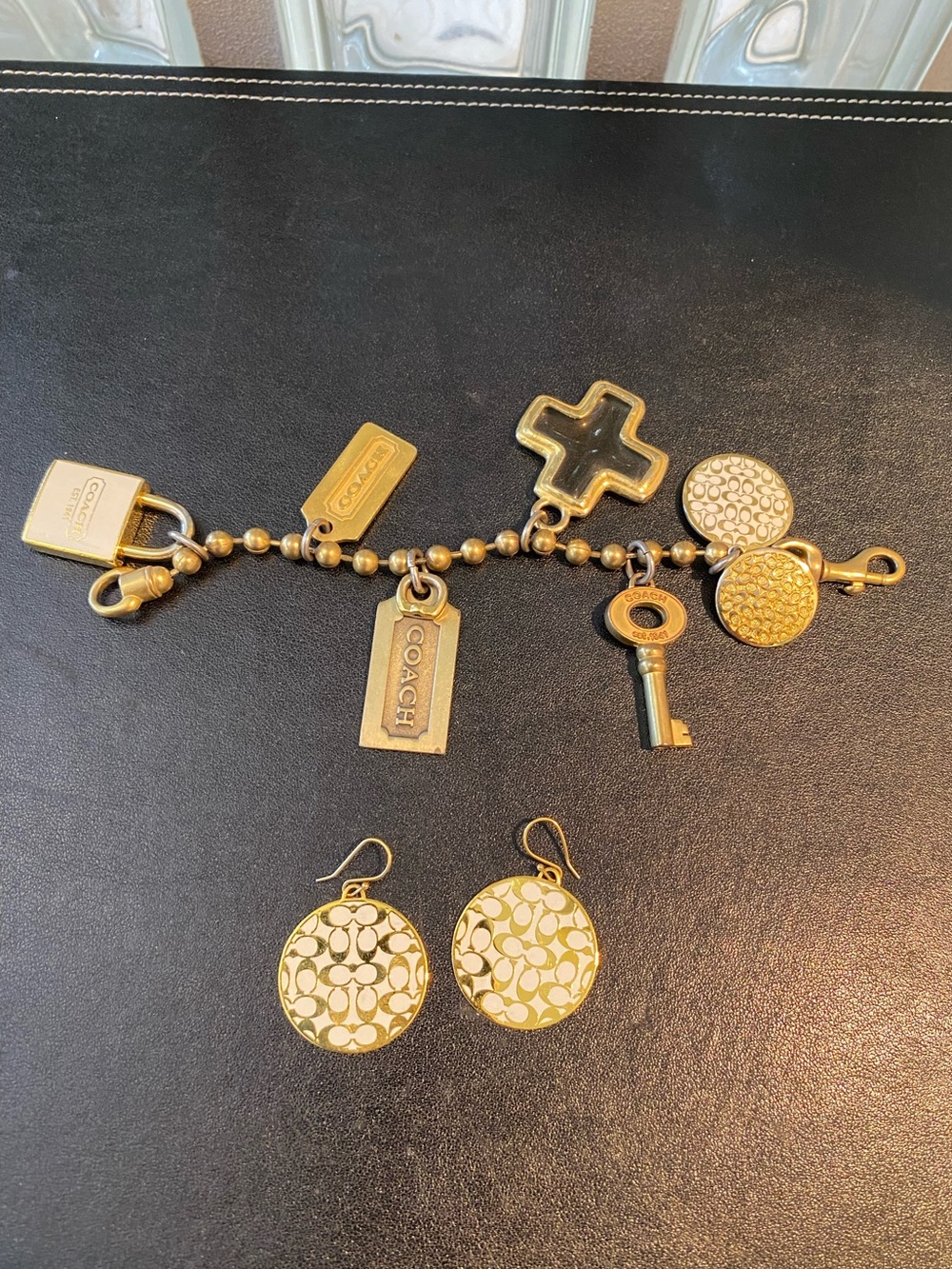 COACH Gold-Tone Brass Charm Bracelet with Signature C Logo Disc Drop Earring Set